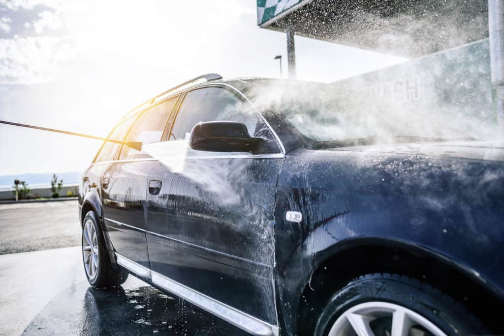 Canva-High-pressure-washing-car-outdoors-1024×684